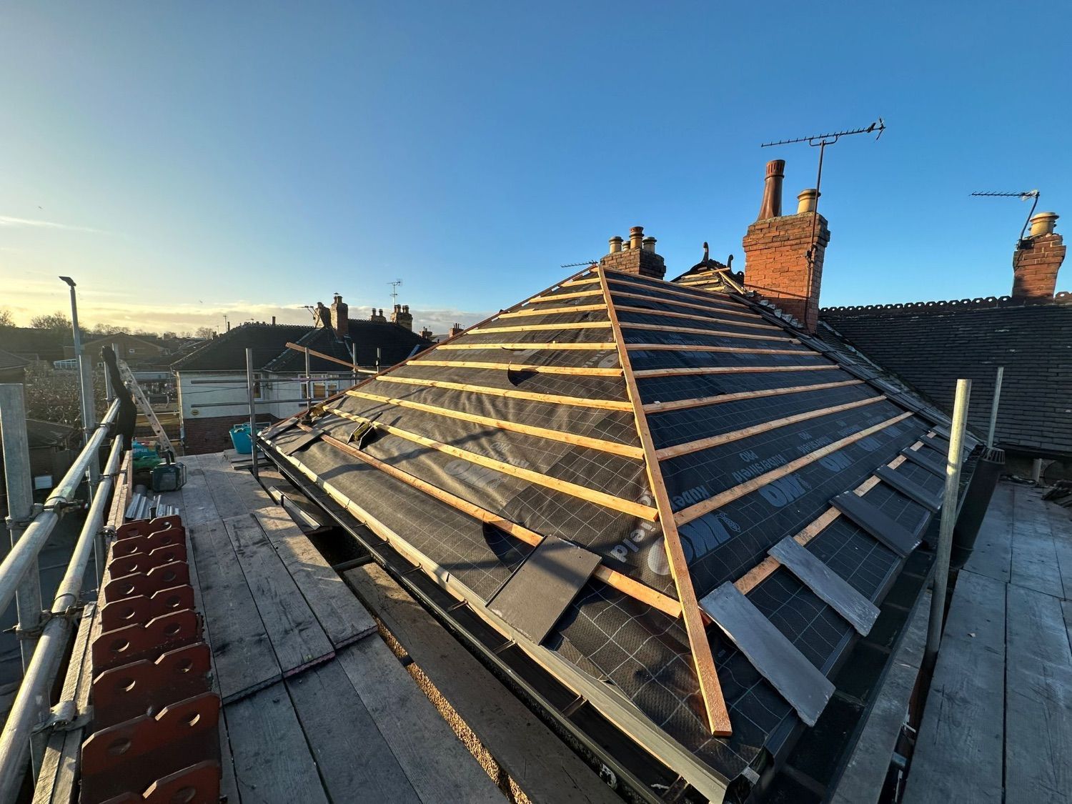 New breathable membrane and timber battens across the hipped roof