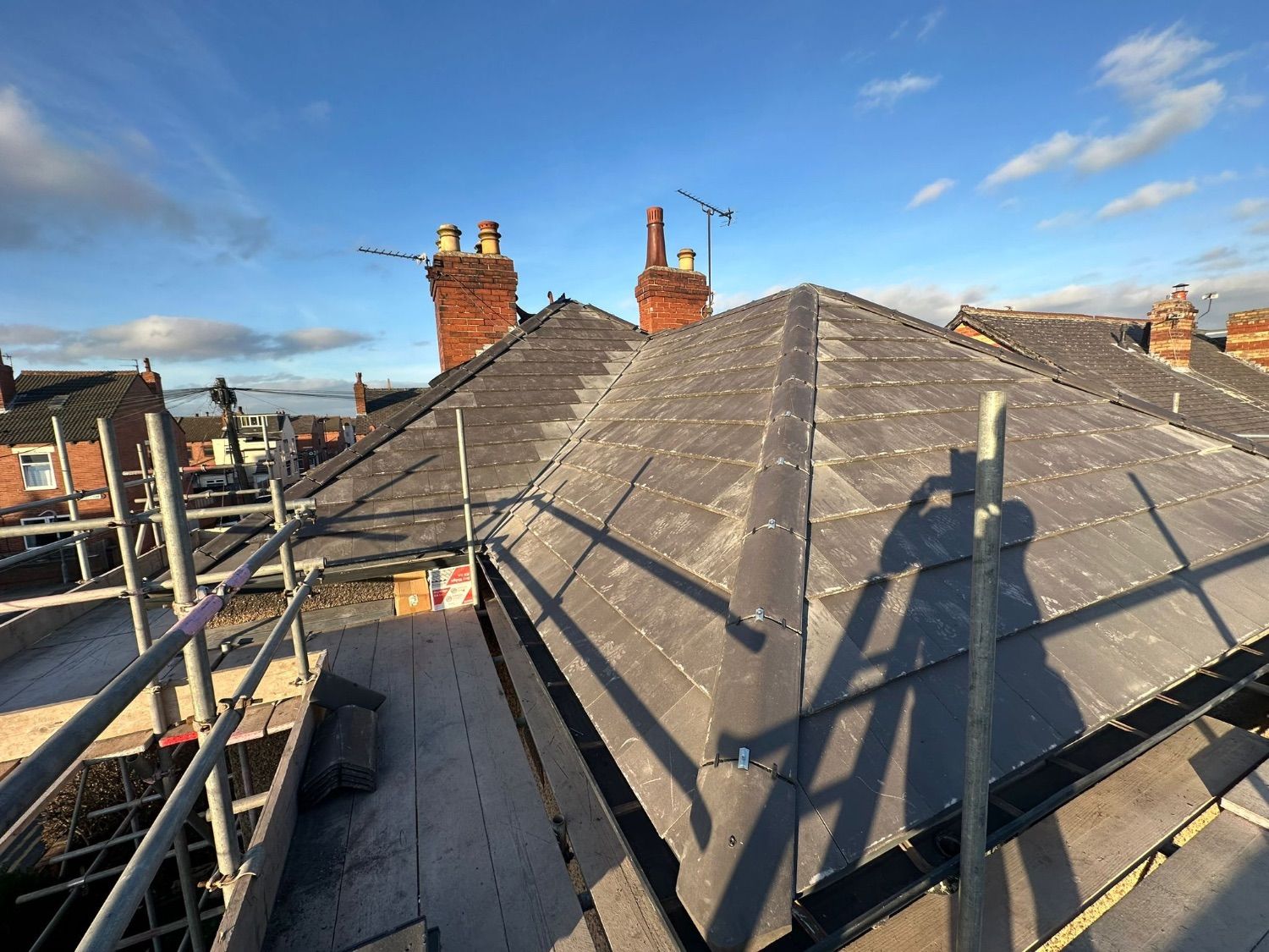 Another side of the finished hipped roof, seen from the scaffold