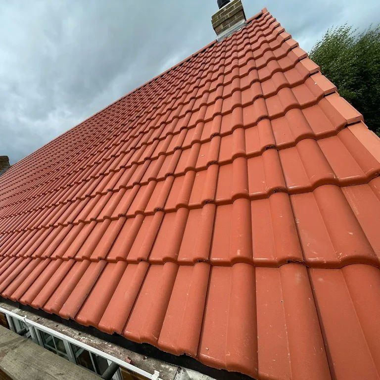 New red interlocking roof tiles with scaffolding in place
