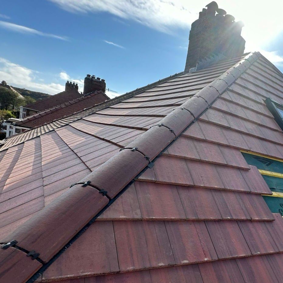 Red tiled roof with a new dry ridge system