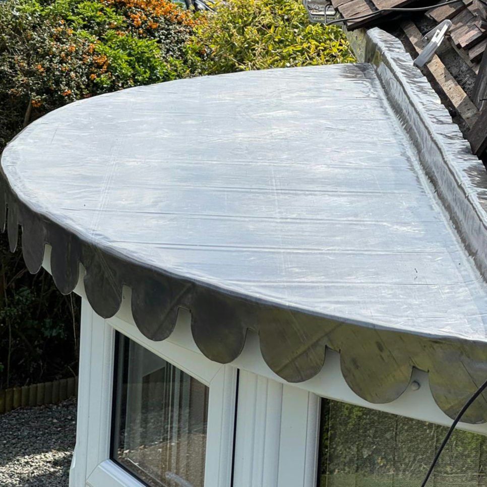 Leaded bay-window roof with a decorative scalloped edge
