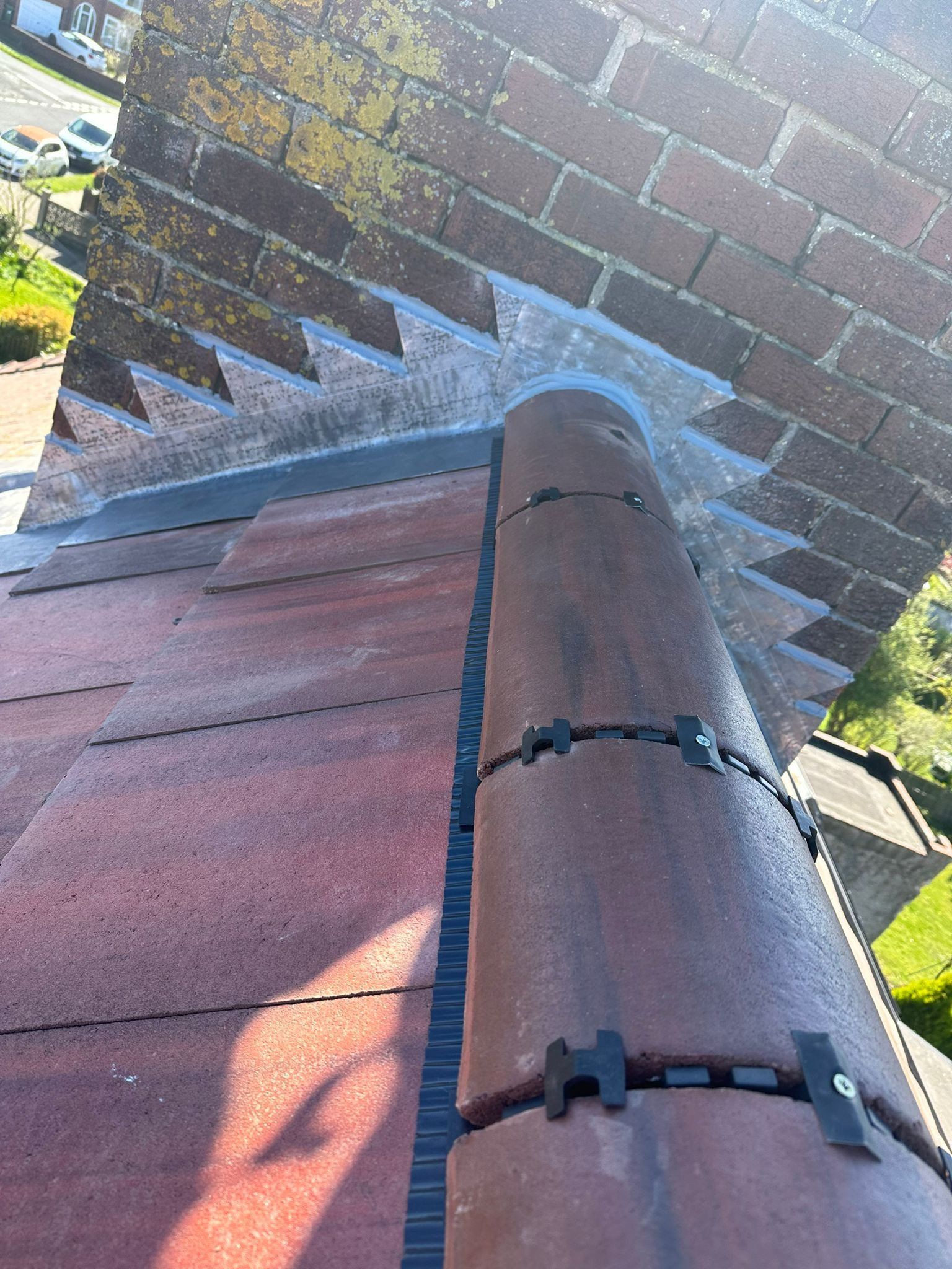 Chimney with new lead flashing and red ridge tiles