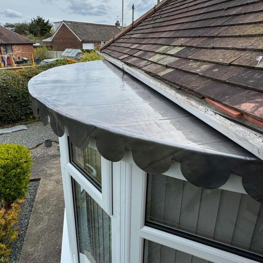 Leaded bay-window roof with scalloped trim