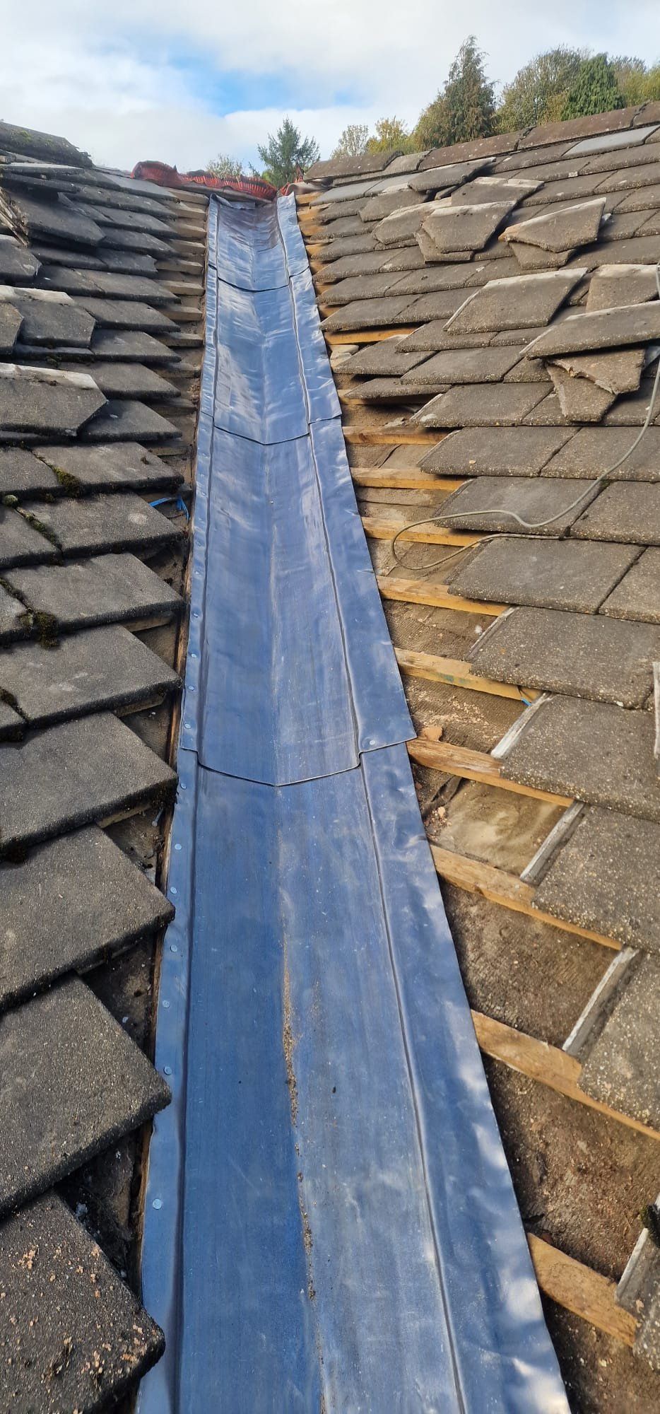 Roof valley stripped out with a new lead lining fitted